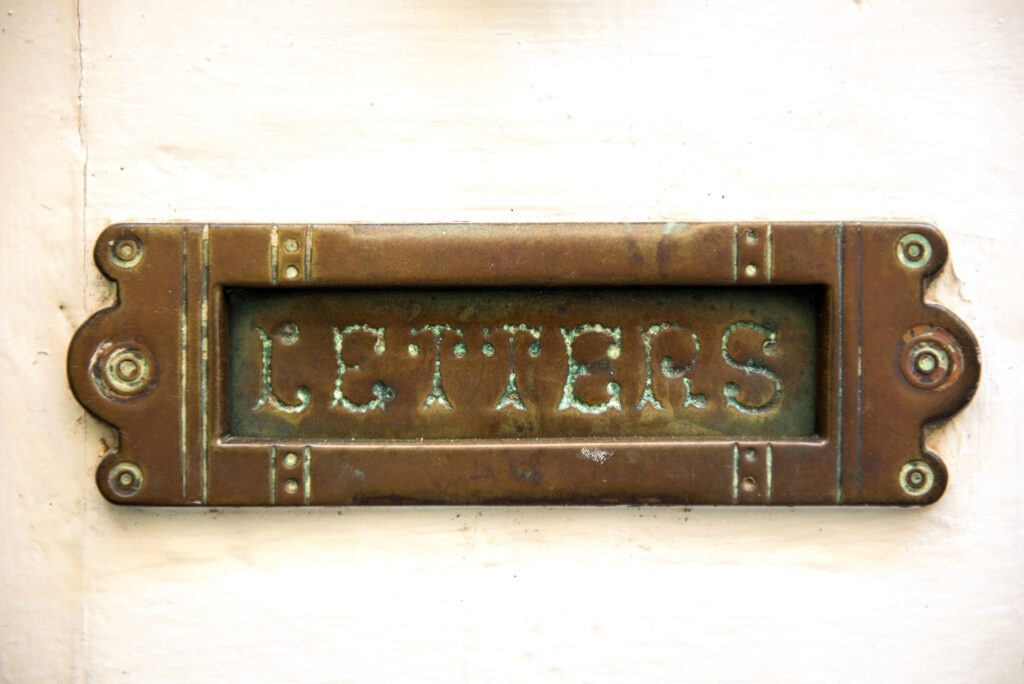 A close up of a letter box