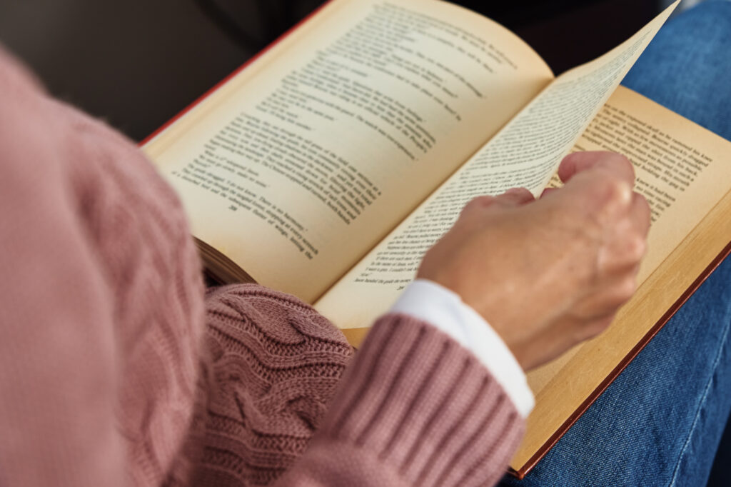 Woman sitting and reading a book