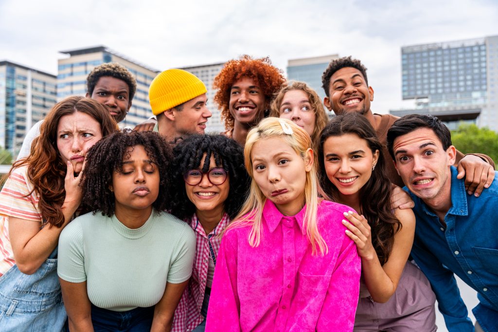 A group of young people make silly faces